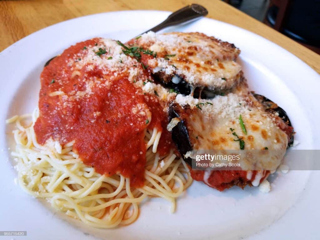 Plate of eggplant parmesan and pasta
